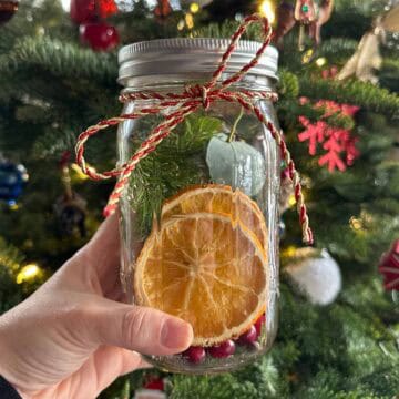 Winter Simmer Pot Jars DIY holiday and winter gift with oranges, cinnamon, and evergreens.