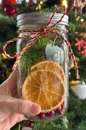 Winter Simmer Pot Jars DIY holiday and winter gift with oranges, cinnamon, and evergreens.