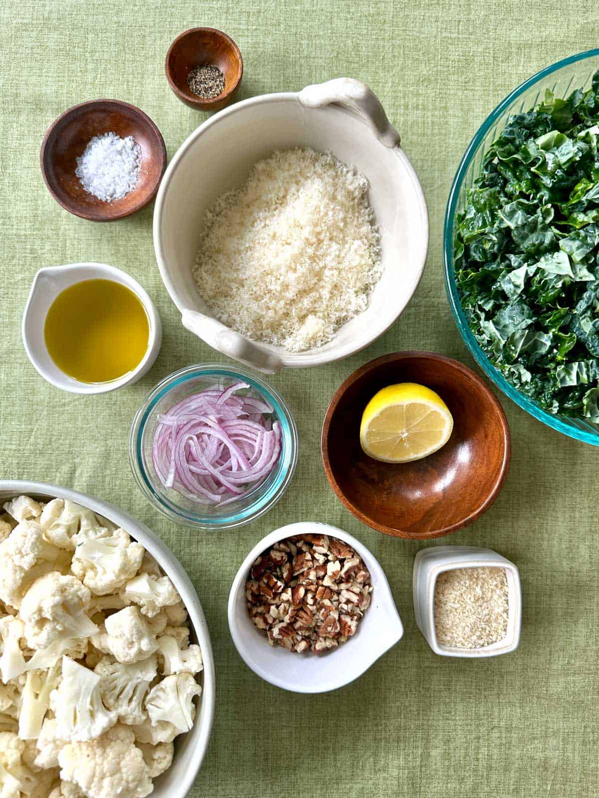 overhead shot of Ingredients for Crispy Cauliflower & Kale Salad in bowls